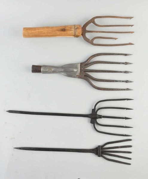 LOT OF 4:  FISH SPEARS.                           