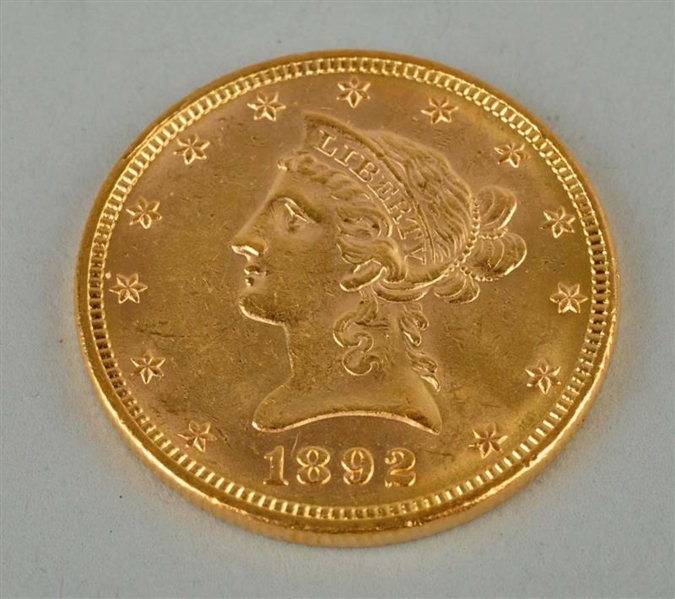 1892 GOLD $10 LIBERTY EAGLE.                      