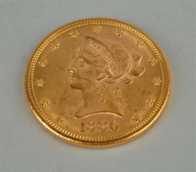 1886 S GOLD $10 LIBERTY EAGLE.                    