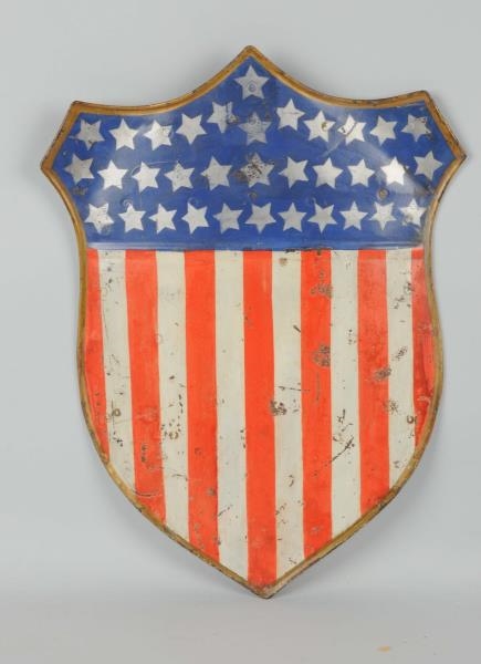 PAINTED TIN AMERICAN FLAG SHIELD.                 