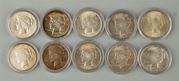 LOT OF 10: MORGAN SILVER COINS IN CASES.          