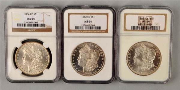 LOT OF 3: MORGAN SILVER DOLLARS IN CASES.         