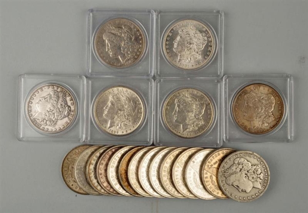 LOT OF 19: MORGAN SILVER DOLLARS IN CASES.        