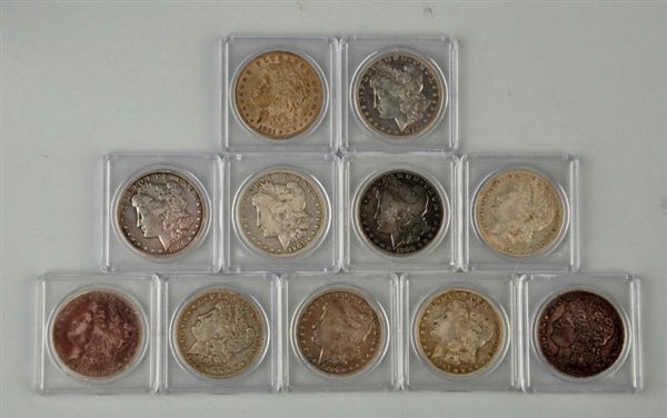 LOT OF 11: MORGAN SILVER DOLLARS IN CASES.        