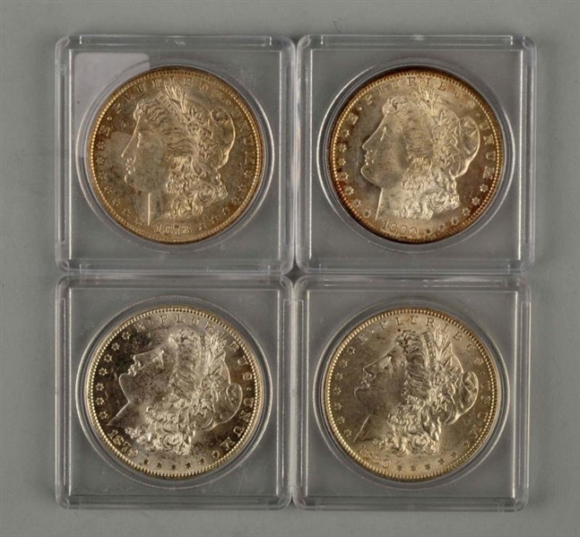 LOT OF 4: MORGAN SILVER DOLLARS IN CASES.         