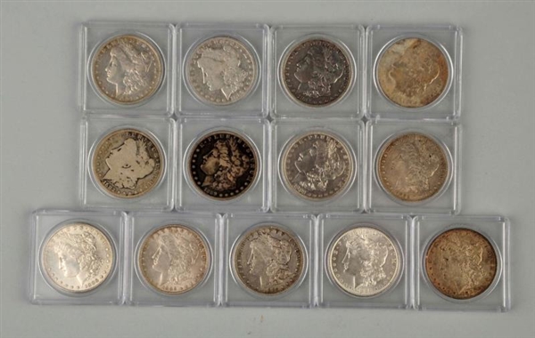 LOT OF 13 : MORGAN SILVER COINS IN CASES.         