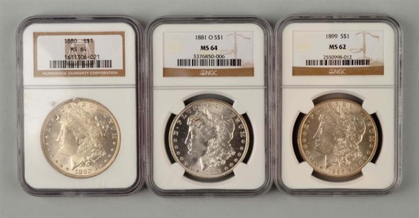 LOT OF 3: MORGAN SILVER DOLLARS IN CASES.         
