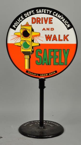DRIVE AND WALK SAFELY WITH NICE GRAPHICS SIGN.    