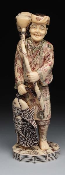 CHINESE CARVED IVORY MAN WITH FISH.               