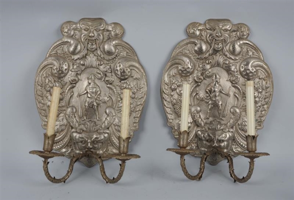 PAIR OF SILVER PLATED ORNATE SCONCES.             