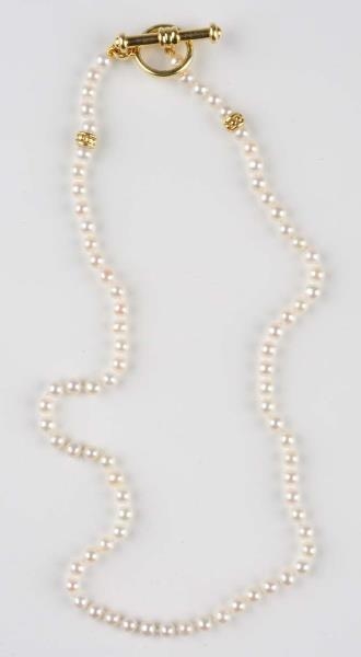 JUDIETH RIPKA STRAND OF PEARLS WITH GOLD.         
