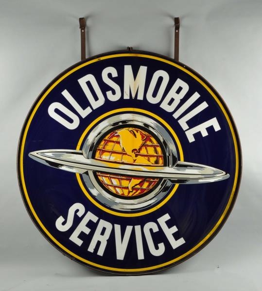 OLDSMOBILE SERVICE WITH WORLD LOGO SIGN.          