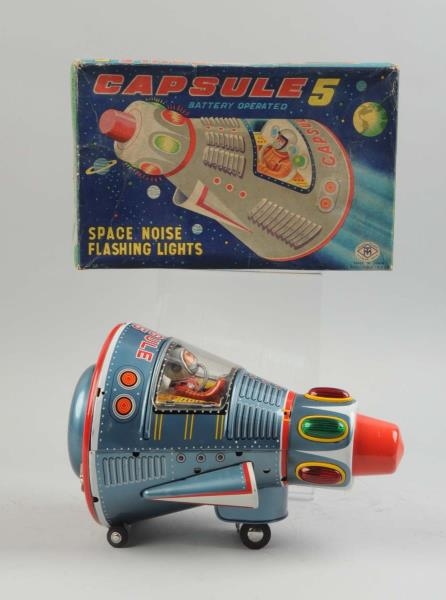 JAPANESE BATTERY OPERATED TIN LITHO SPACE CAPSULE.