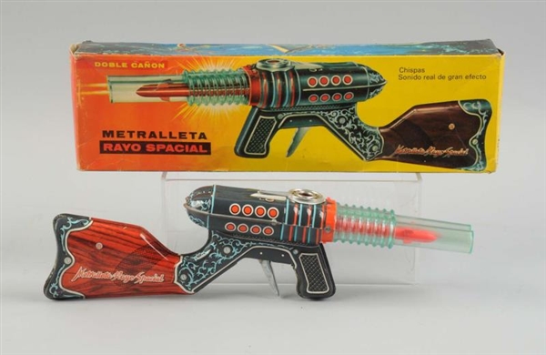 SPANISH TIN LITHO FRICTION SPACE RIFLE IN BOX.    