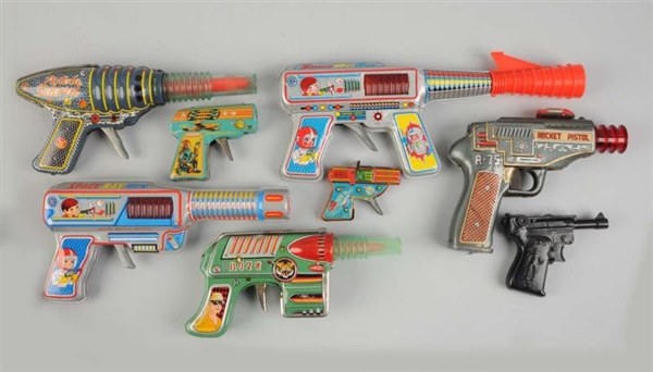 LOT OF 8: FOREIGN MADE SPACE AND CHARACTER GUNS.  