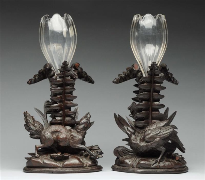 PAIR OF CAVED WOODEN CANDLESTICKS WITH ANIMALS.   