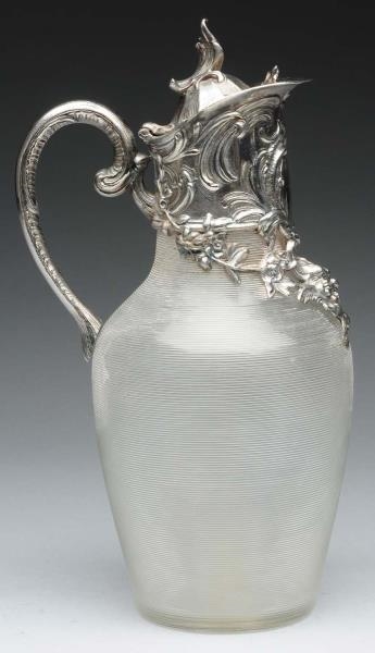 SILVER MOUNTED GLASS DECANTER.                    