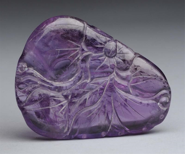 CHINESE CARVED AMETHYST WITH FLOWER DESIGN.       