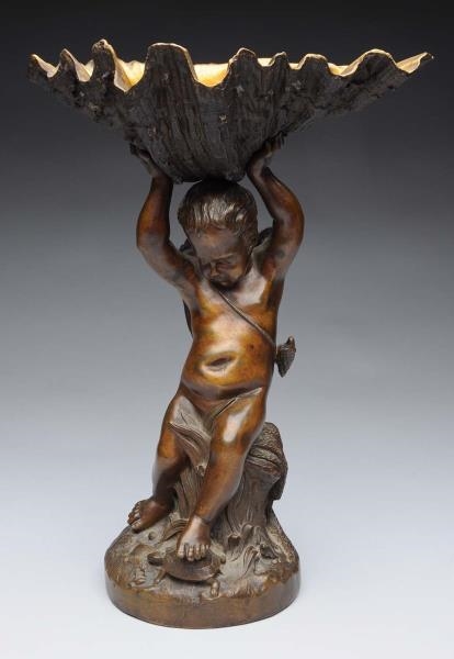 FRENCH BRONZE PUTTI HOLDING SHELL.                