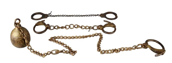 SET OF HAND CUFFS, LEG IRONS, AND BALL AND CHAIN  