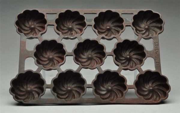 GRISWOLD CAST IRON MUFFIN TRAY.                   