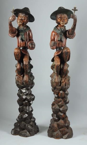 PAIR OF BLACK FOREST CARVED GUARD MONKEYS.        