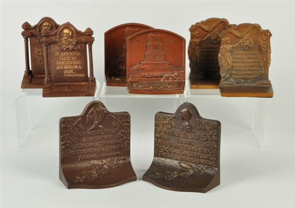 LOT OF 8: CAST IRON BOOKENDS WITH QUOTES.         