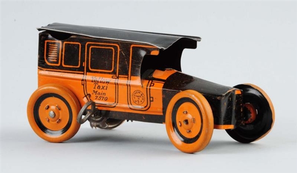CHEIN TIN LITHO WIND UP YELLOW TAXI TOY.          