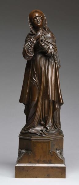 SMALL BRONZE FIGURE OF A WOMAN.                   