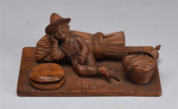 EARLY FIGURAL CARVED WOOD INKWELL.                