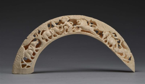 AFRICAN IVORY TUSK WITH CARVED ANIMALS.           