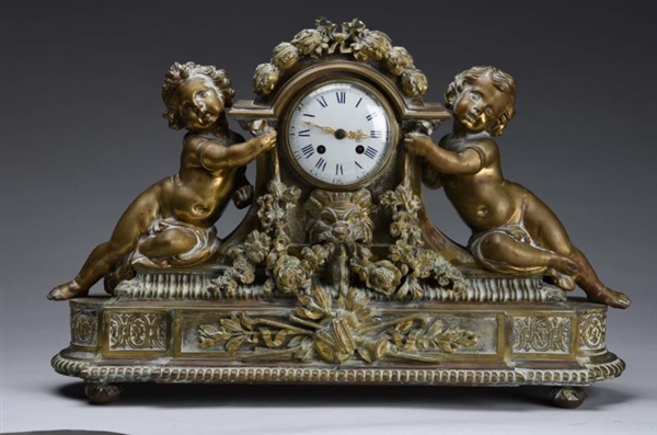 EARLY BRONZE SHELF CLOCK WITH INFANTS.            