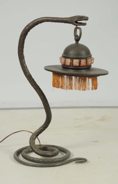 ART NOUVEAU HAMMERED BRONZE SNAKE LAMP.           