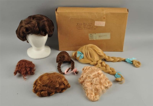 LOT OF 6: ASSORTED DOLL WIGS.                     
