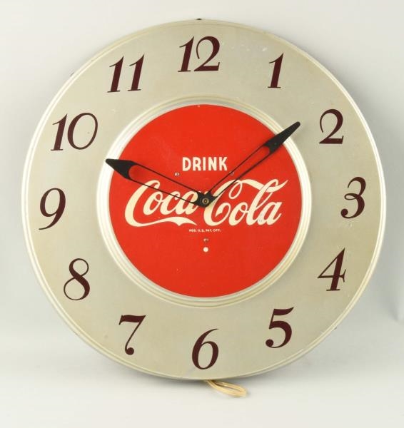 1950S COCA-COLA SILVER ELECTRIC CLOCK.           