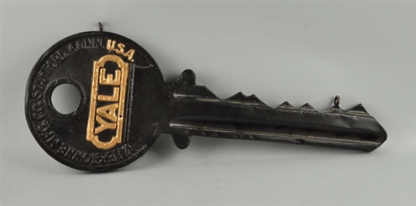 PLASTIC PAINTED YALE KEY TRADE SIGN.              