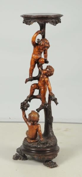 CARVED FRUIT-WOOD STAND OF BOYS CLIMBING.         