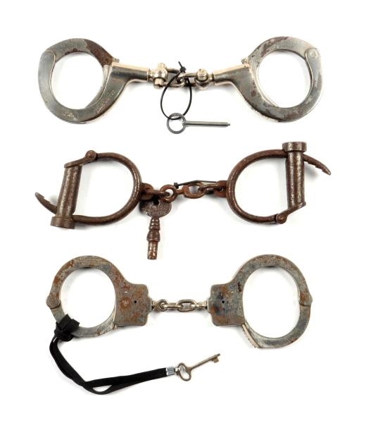 LOT OF 3: EARLY HANDCUFF SETS.                    