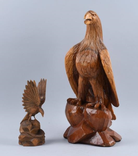 LOT OF 2: HAND CARVED WOODEN EAGLES.              