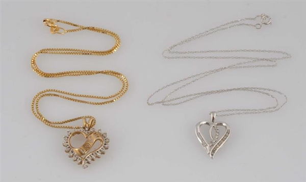 LOT OF 2: DIAMOND HEART NECKLACES.                