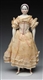 12" CHINA DOLL WITH RARE MOLDED BONNET.           