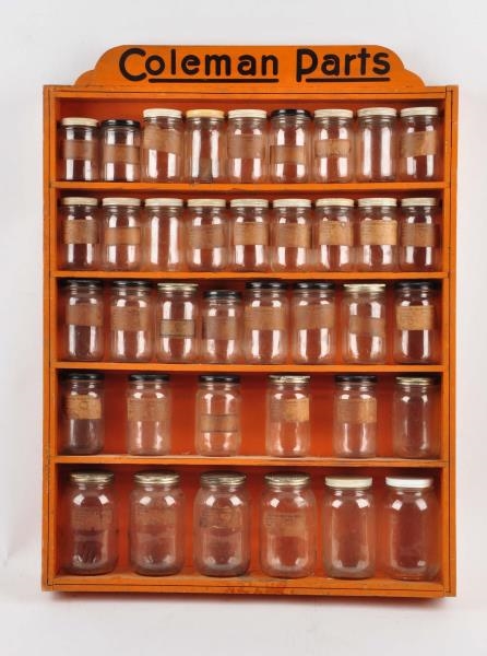 COLEMAN WOODEN PARTS CABINET WITH BOTTLES.        
