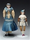 PAIR OF RARE PARIAN DOLLS WITH MOLDED HATS        