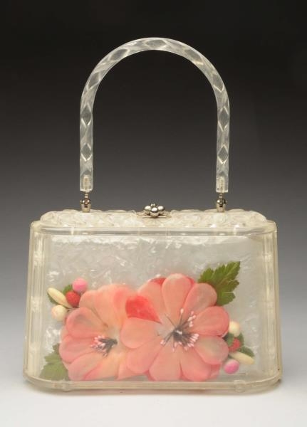 LUCITE PURSE WITH ENCASED FLOWERS.                