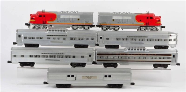 LOT OF 7: LIONEL TRAIN ENGINES AND CARS IN BOXES. 