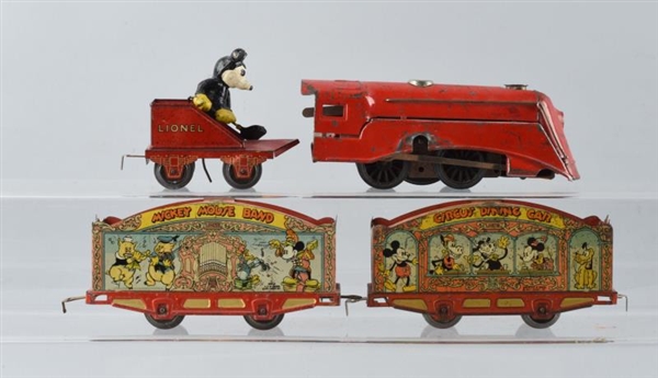LOT OF 4: LIONEL MICKEY MOUSE TIN TRAIN SET.      