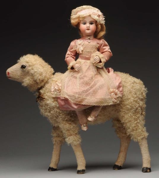 LARGE NODDING SHEEP WITH BISQUE DOLL.             