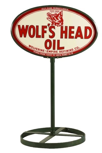WOLFS HEAD OIL WITH LOGO TIN OVAL CURB SIGN.     