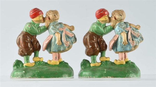 CAST IRON KISSING DUTCH GIRL AND BOY BOOKENDS.    