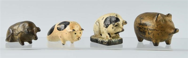 LOT OF 4: CAST IRON ASSORTED PIG PAPERWEIGHTS.    